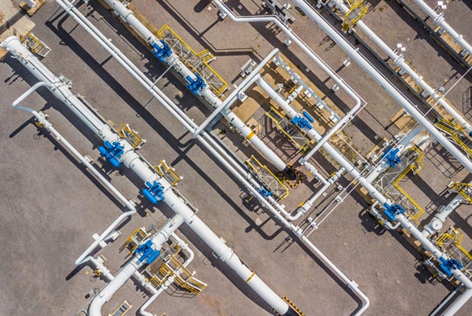 Image of pipes at LNG plant representing Lacima's software which can be utilised for trading, valuation and risk analytics for gas and LNG sectors