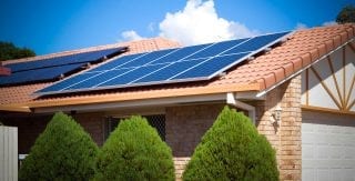 Image of solar panels on residential home roof, reflecting Lacima's renewable energy generation valuation and risk analytics solutions for the retail energy industry such as Lacima Client Canadian Solar