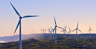 Image of coastal wind power generation, reflecting Lacima's renewable energy valuation and risk analytics solutions
