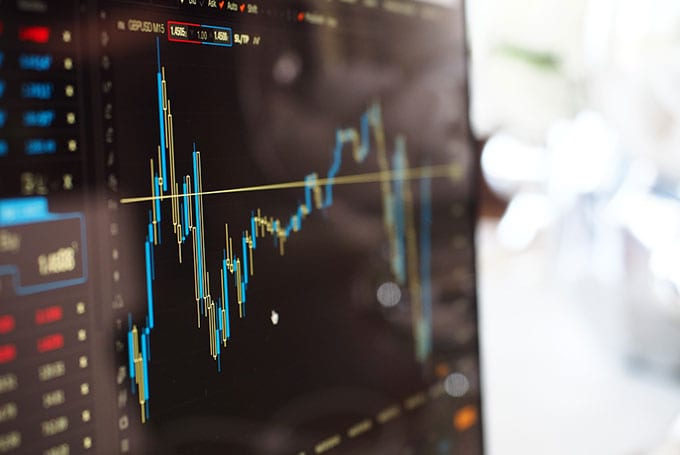 Power and gas trading desk representing outsourced energy risk management services across US markets